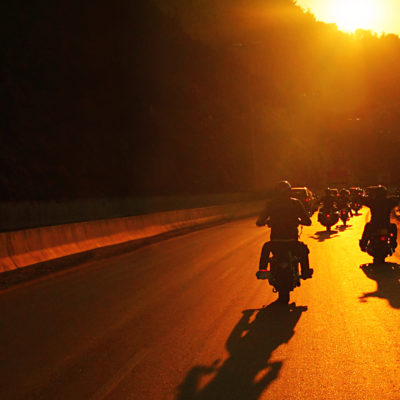Riders on an Open Road at Sunset